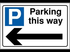 Parking this way sign